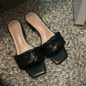 Black heels. Never worn